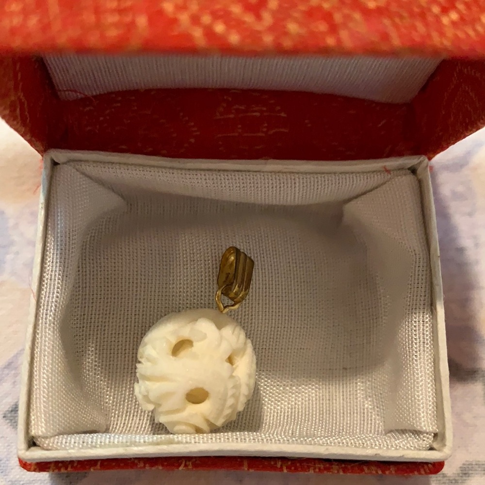 Carved pendant with scene